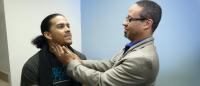 Dr. David Bell examining a patient